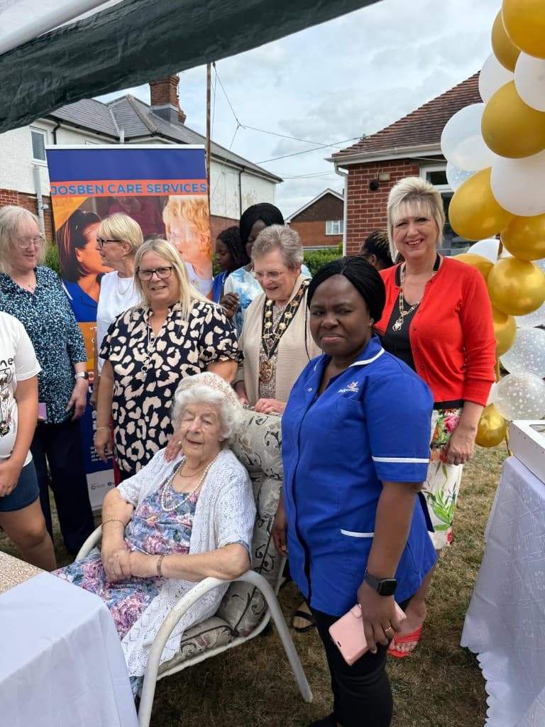Josben Care team gathered outdoors with a client